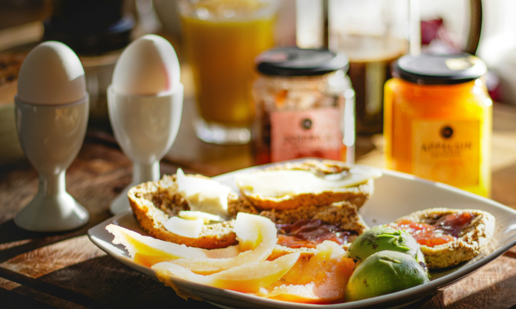 High protein breakfast with rich protein foods: oat, eggs, guava and whole wheat bread