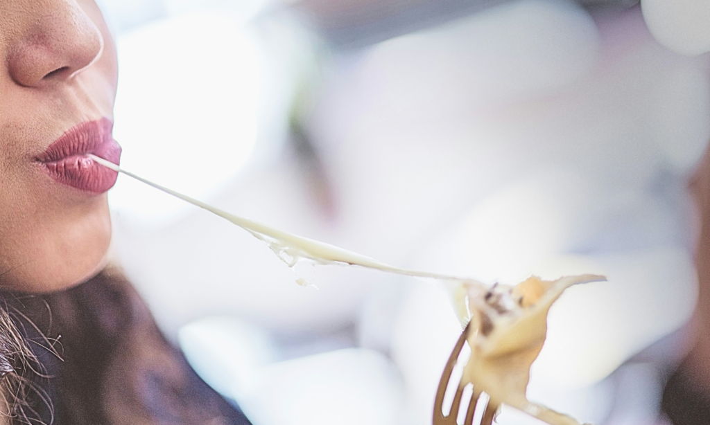 Woman eating cheese for a high protein meal